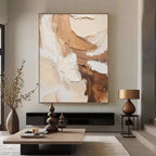 Large vertical minimalist abstract 3D textured canvas painting with brown, beige, and white earth tones, creamy impasto brush