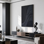 Modern living room with minimalist black textured canvas art above console table.