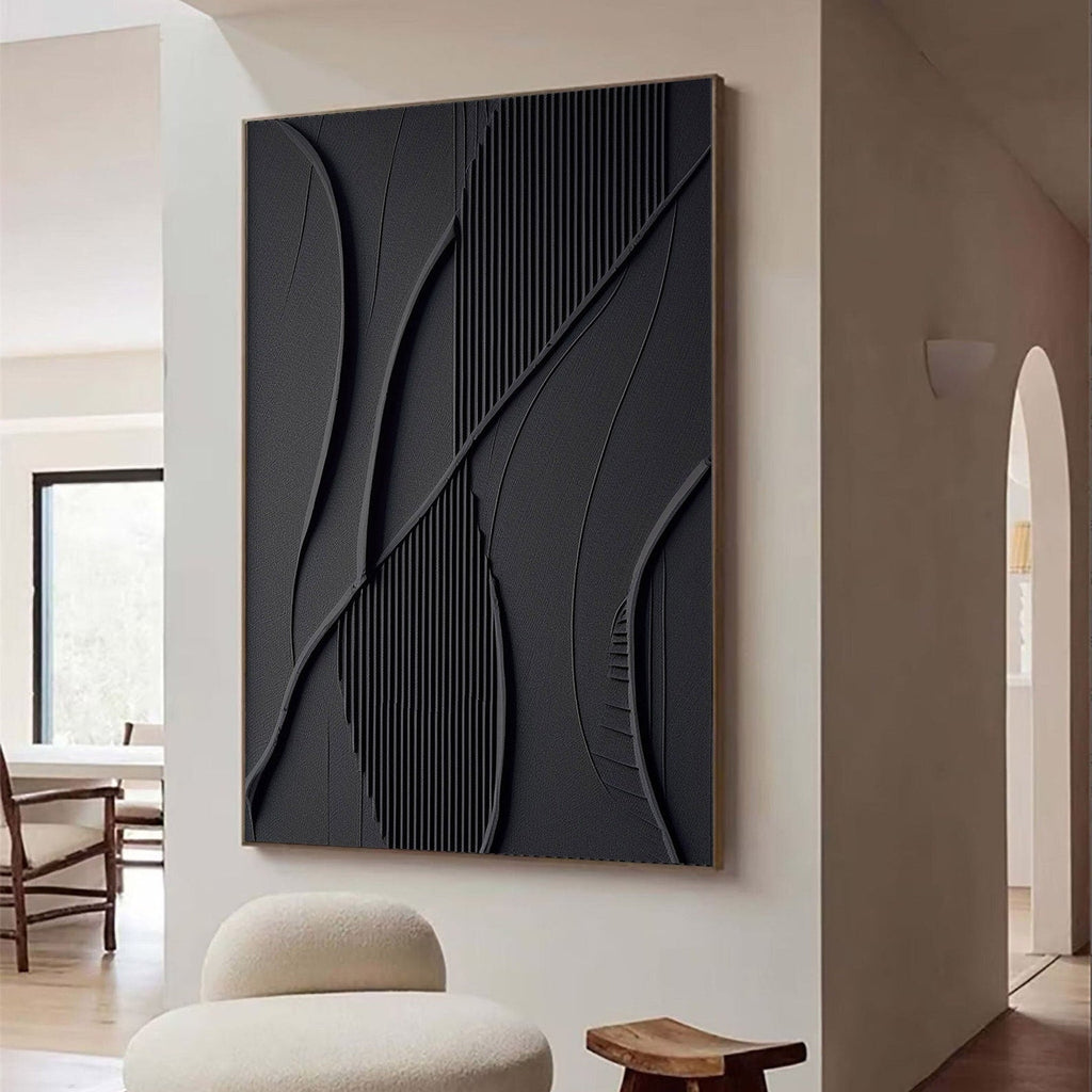 Black minimalist geometric 3D textured wall art with shadow lines by Lumi Gallery, mounted on white wall in modern interior