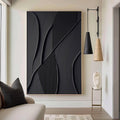 Lumi Gallery's minimalist geometric 3D textured black wall art with shadow lines in modern living room