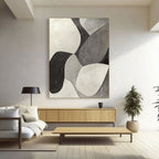 Minimalist canvas art above console table in living space.