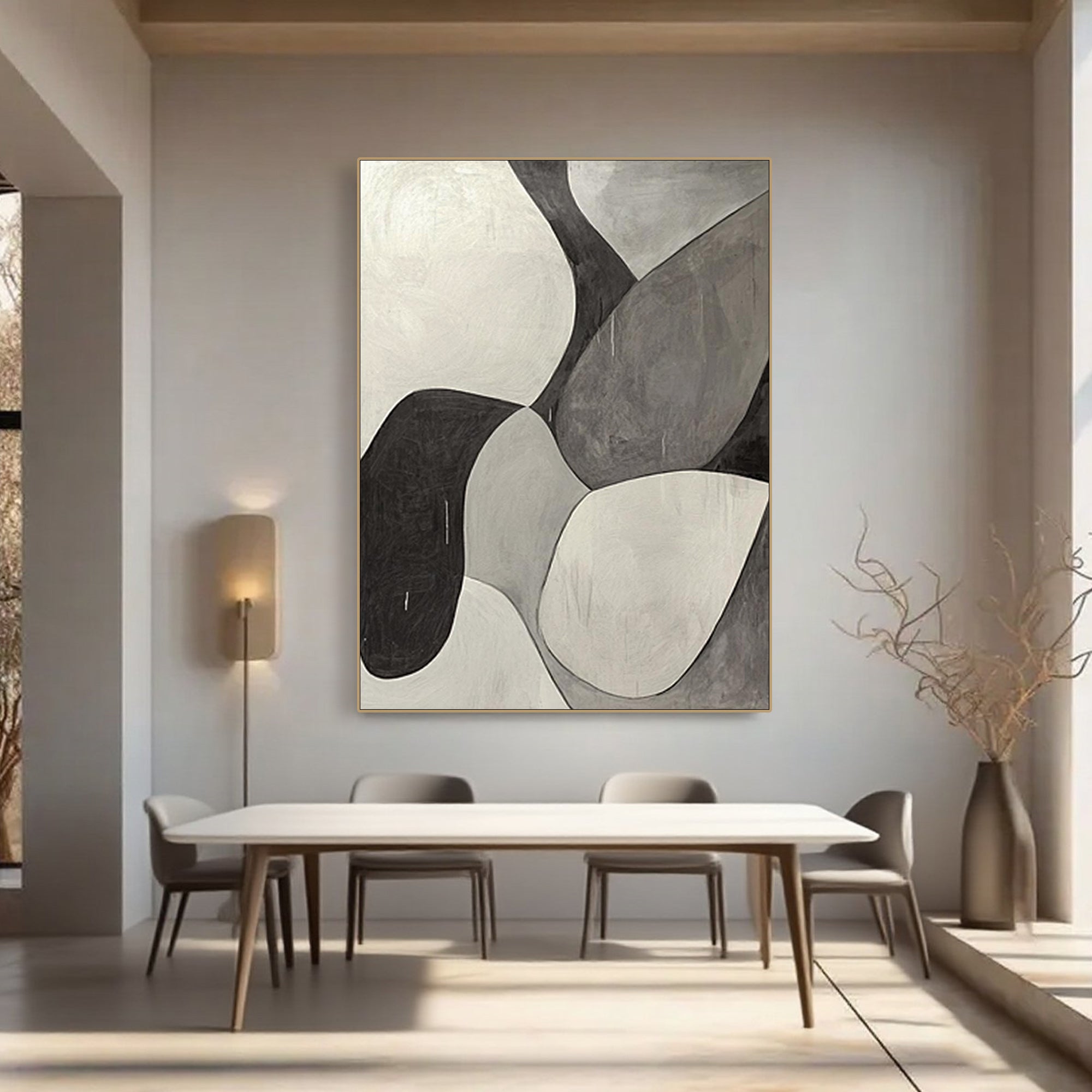 Minimalist geometric abstract canvas art in living room. Black, white, and grey.
