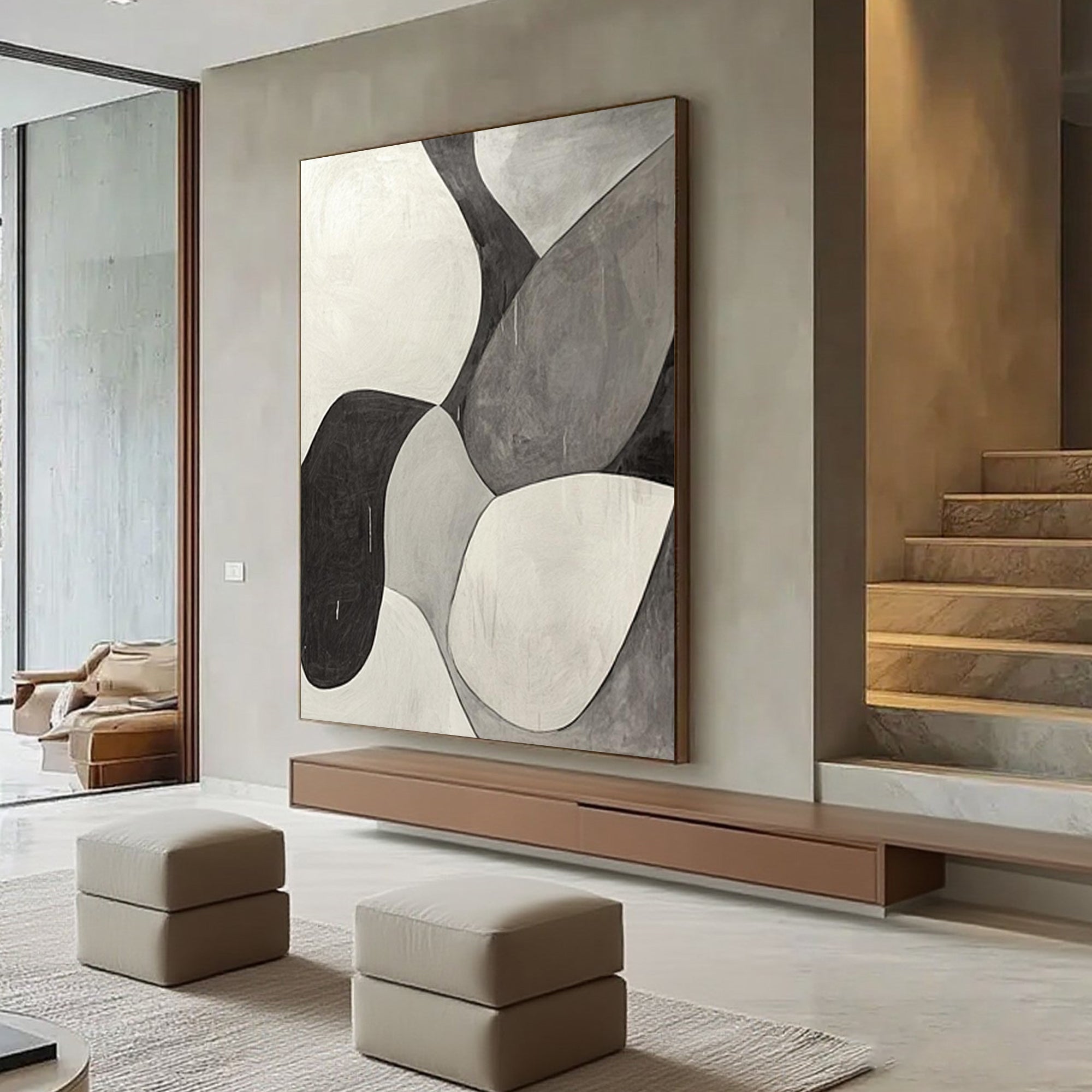 Abstract canvas art hanging in modern living room setting.