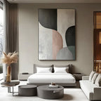 Minimalist painting in a bedroom with neutral color palette and modern furniture.
