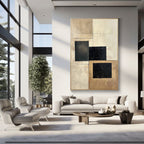 Beige & black geometric canvas art in a modern, bright living space.