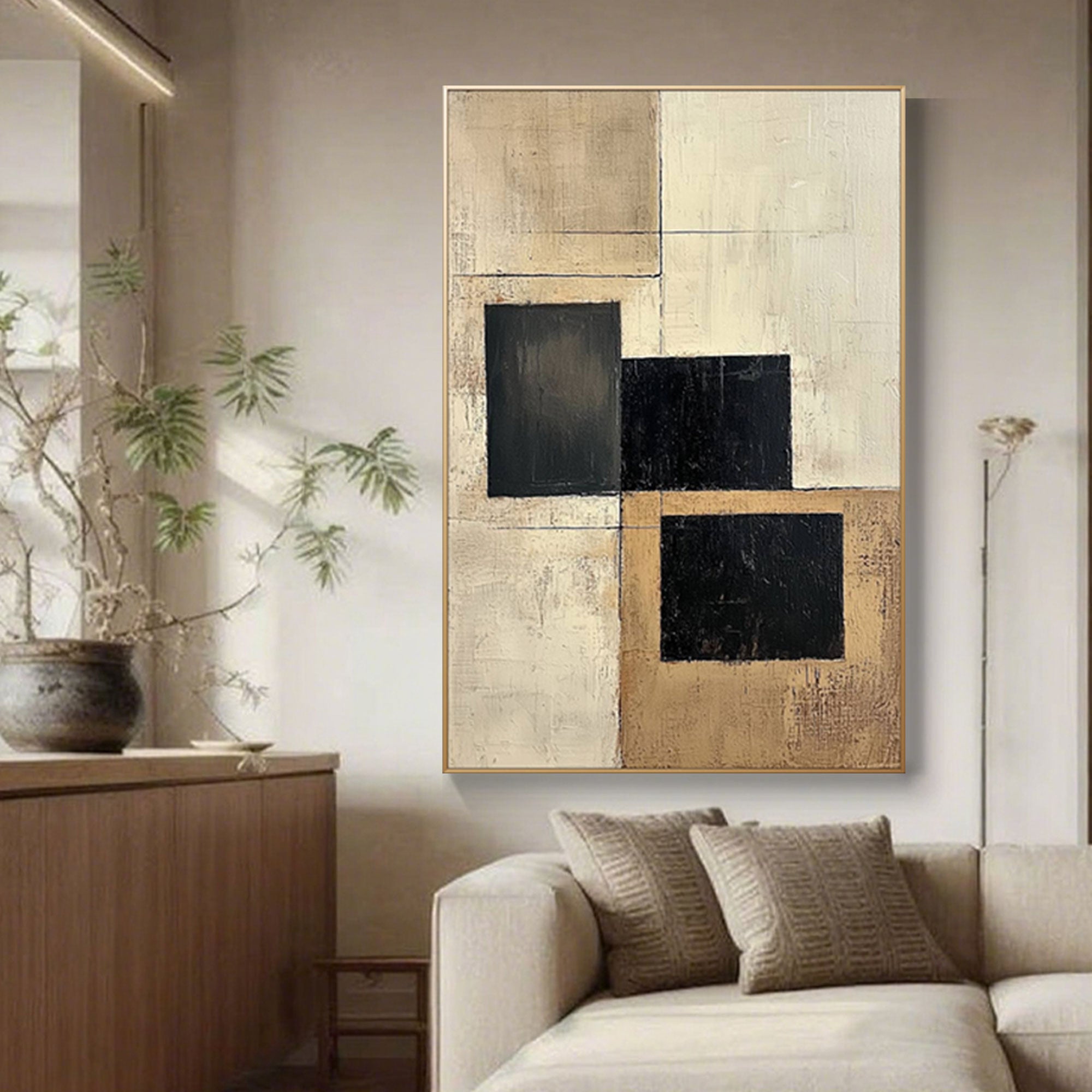 Framed geometric canvas art: hand-painted black & beige blocks.