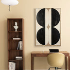 Minimalist geometric canvas art: Black circles on beige background.