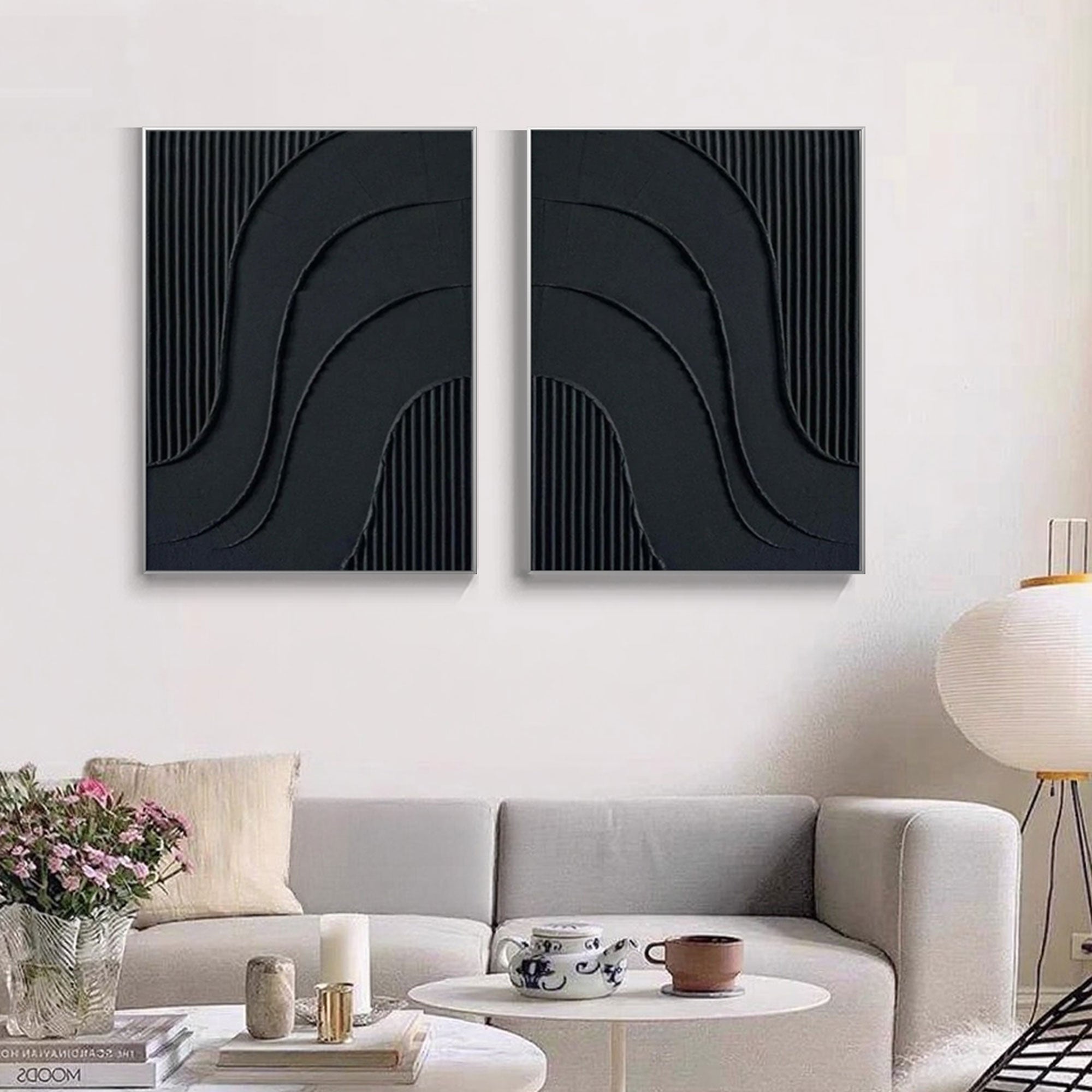 Black geometric modern art featuring curved reliefs and vertical textures.