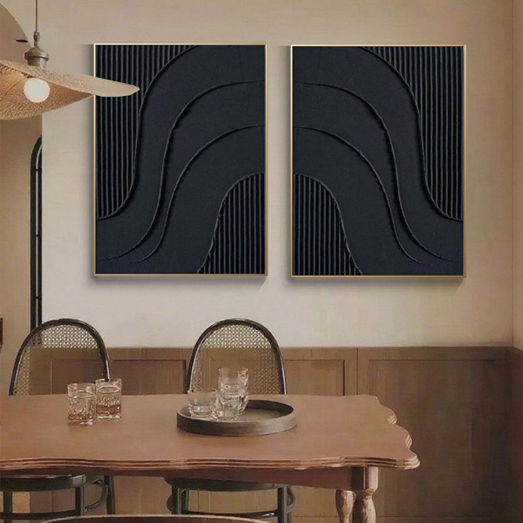 Close up of black canvas art featuring curved reliefs and vertical stripes
