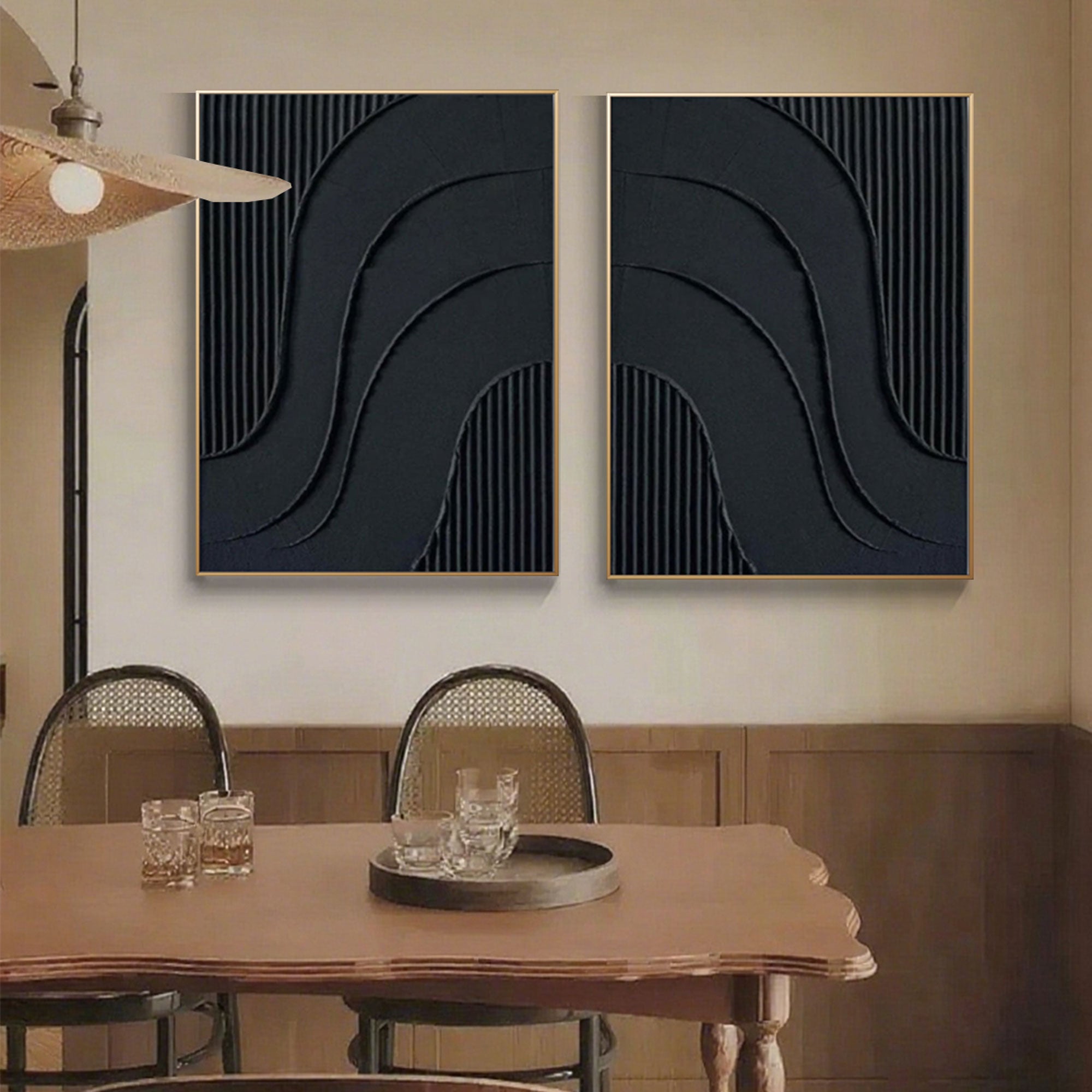 Close up of black canvas art featuring curved reliefs and vertical stripes