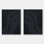 Minimalist black wall art featuring curved reliefs and vertical textures.