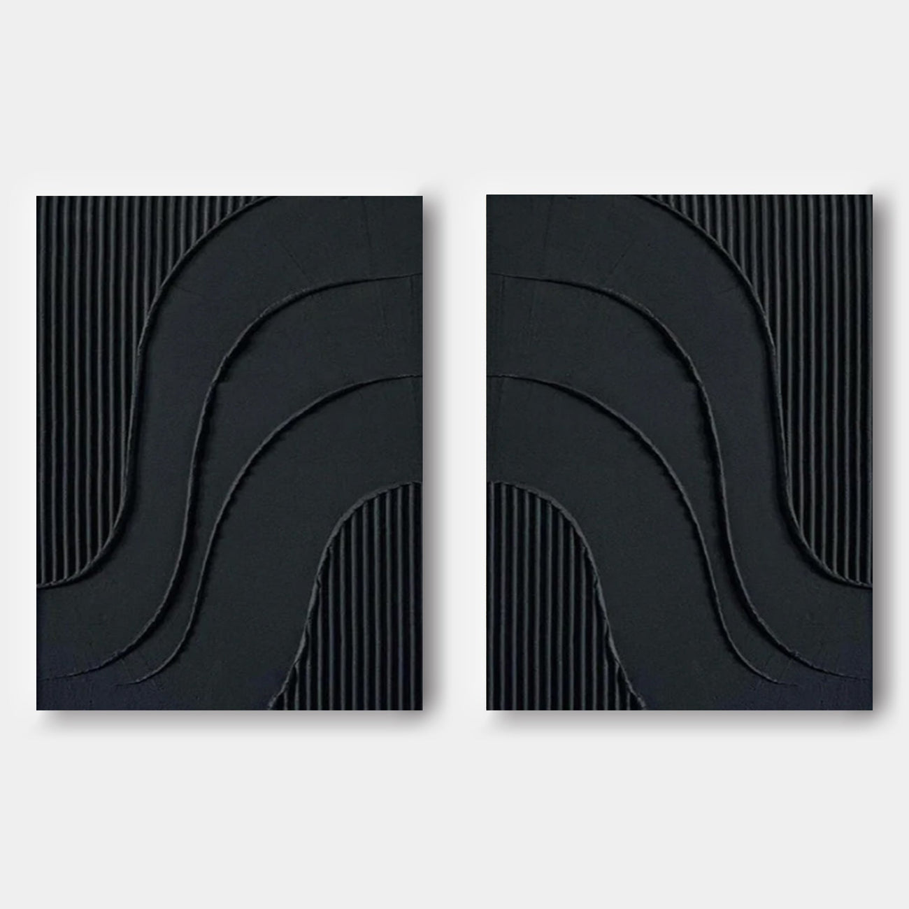Minimalist black wall art featuring curved reliefs and vertical textures.