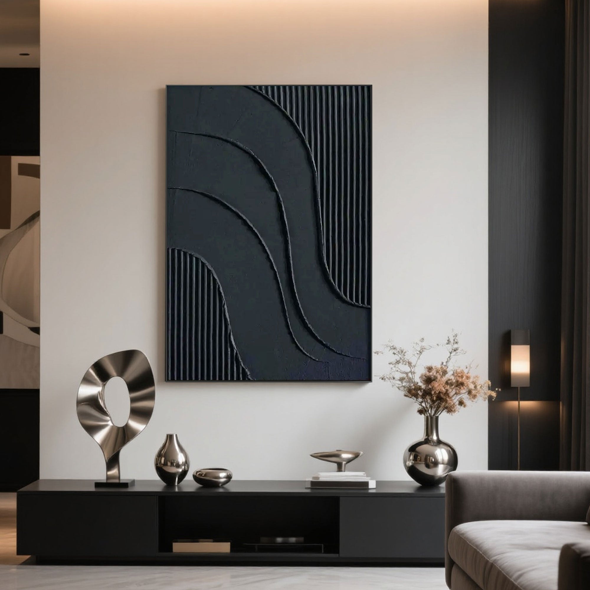 Black geometric canvas art display in a modern living space.