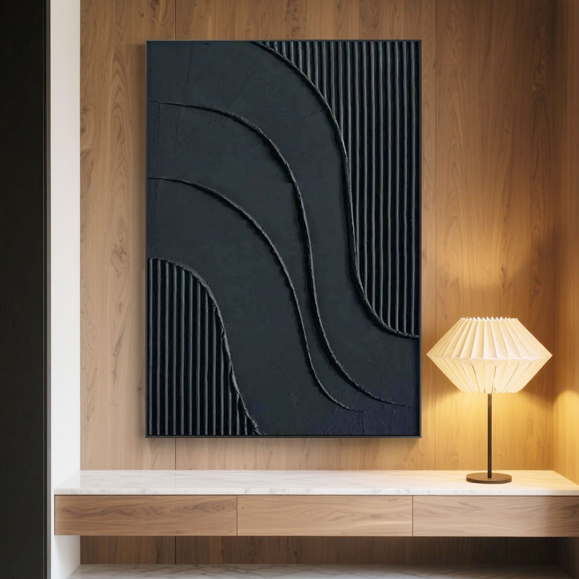 Minimalist black geometric art above console table.