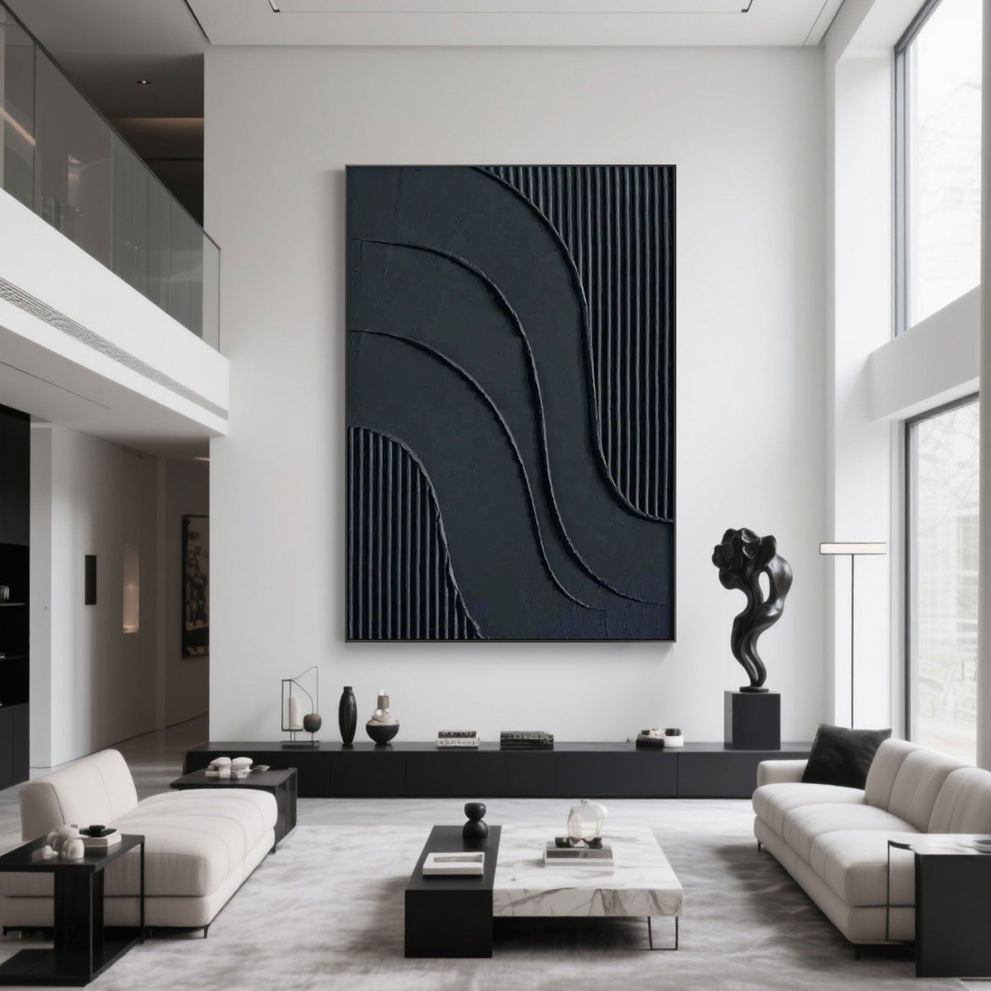 Large minimalist black wall art in modern living room interior.