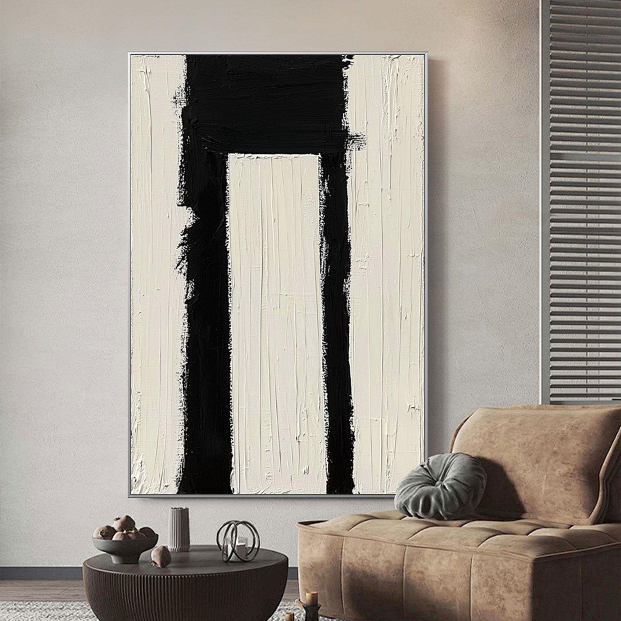 Minimalist geometric Passage wall art in black and white over a sofa.