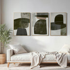 Strata minimalist art set in earthy tones above a modern sofa.