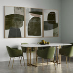 Earthy toned geometric canvas art above a modern dining table.