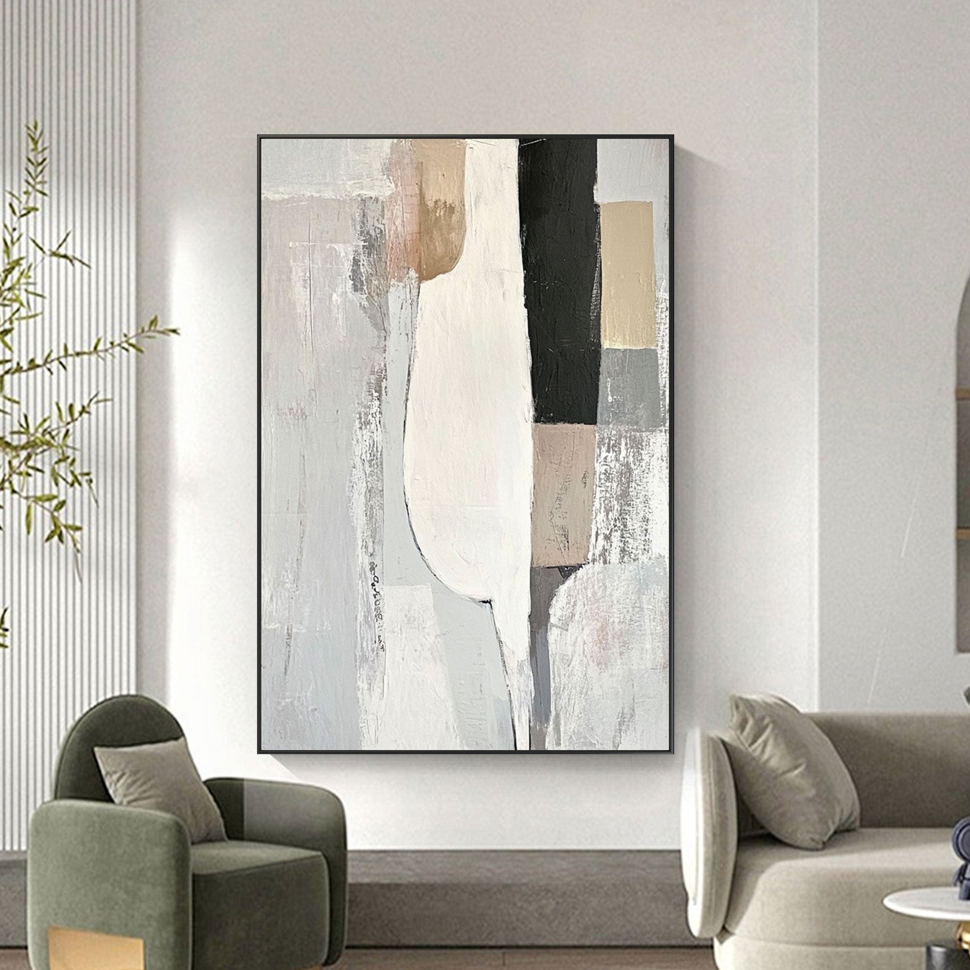 Minimalist geometric wall art in neutral tones of white, beige, and black in living room.