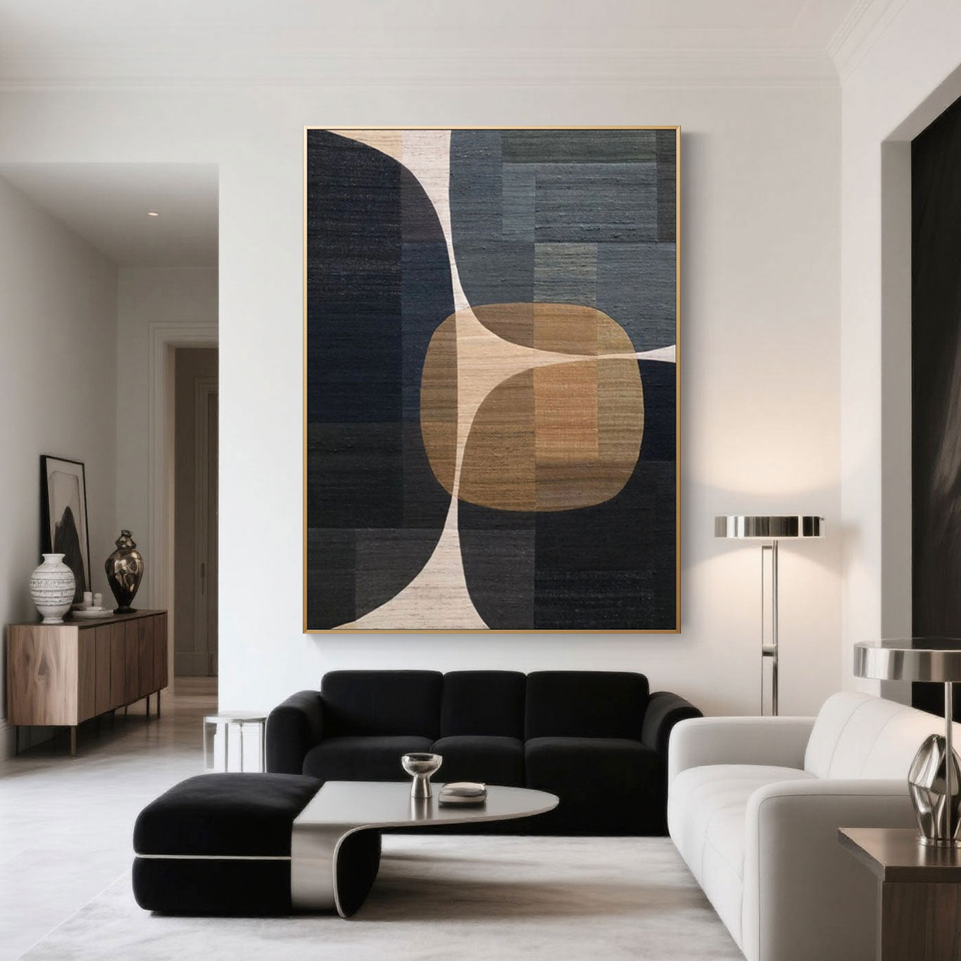 Intersecta geometric art above a black sofa in modern living room