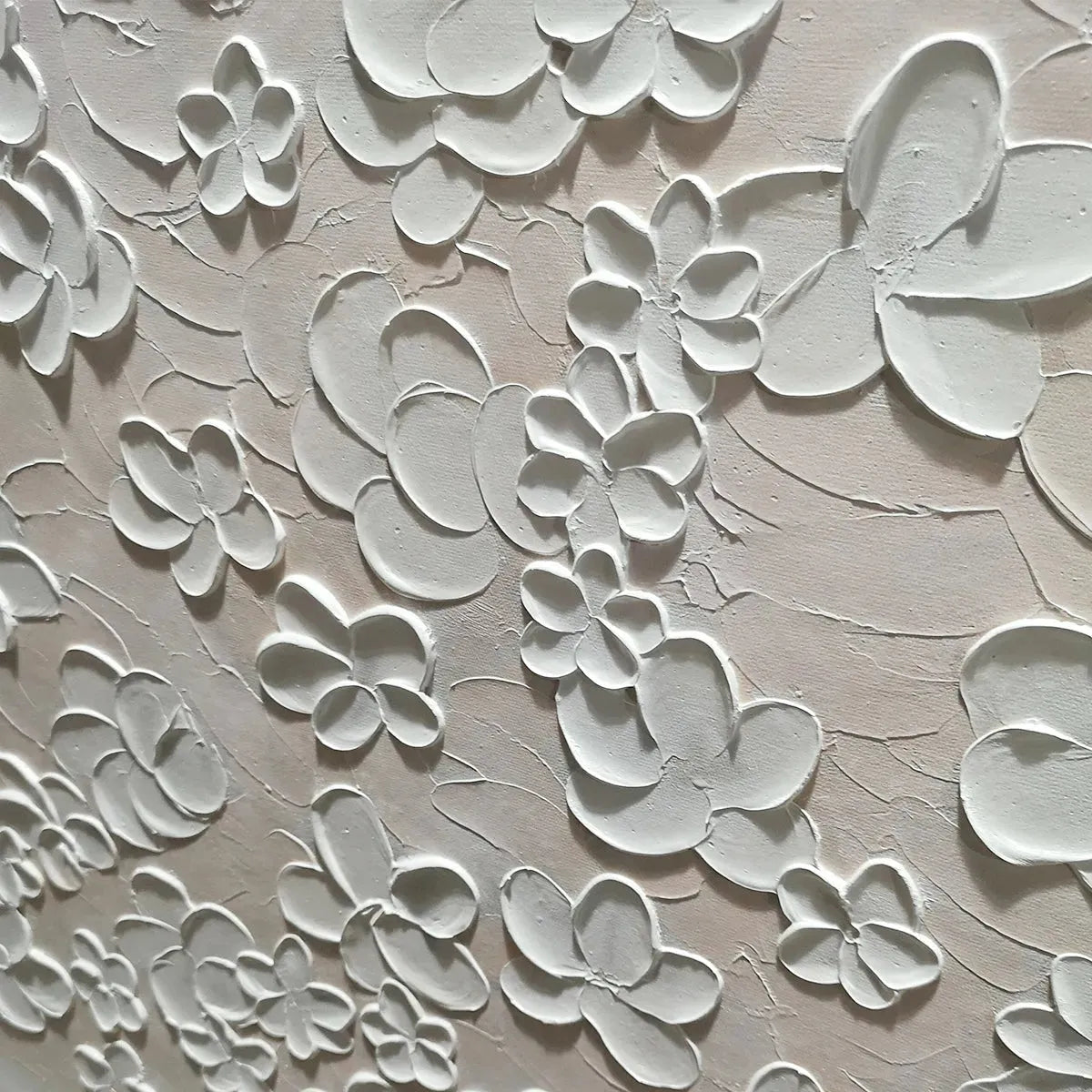 Close-up of the white palette knife sculpted floral details on the painting.