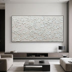 Minimalist textured floral painting in a modern living room.