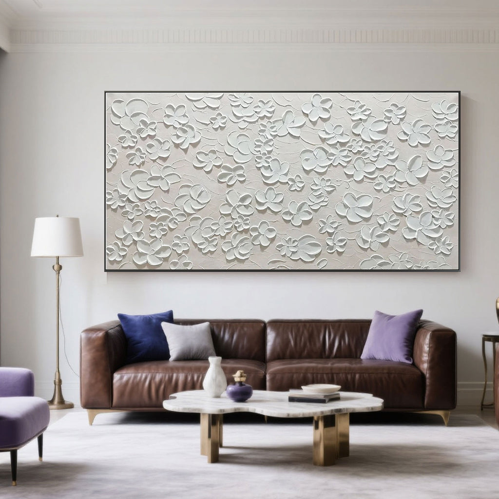 Minimalist textured floral painting in a modern living room.