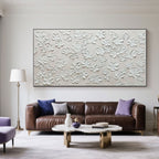 Minimalist textured floral painting in a modern living room.