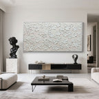Minimalist textured floral painting in a modern living room.