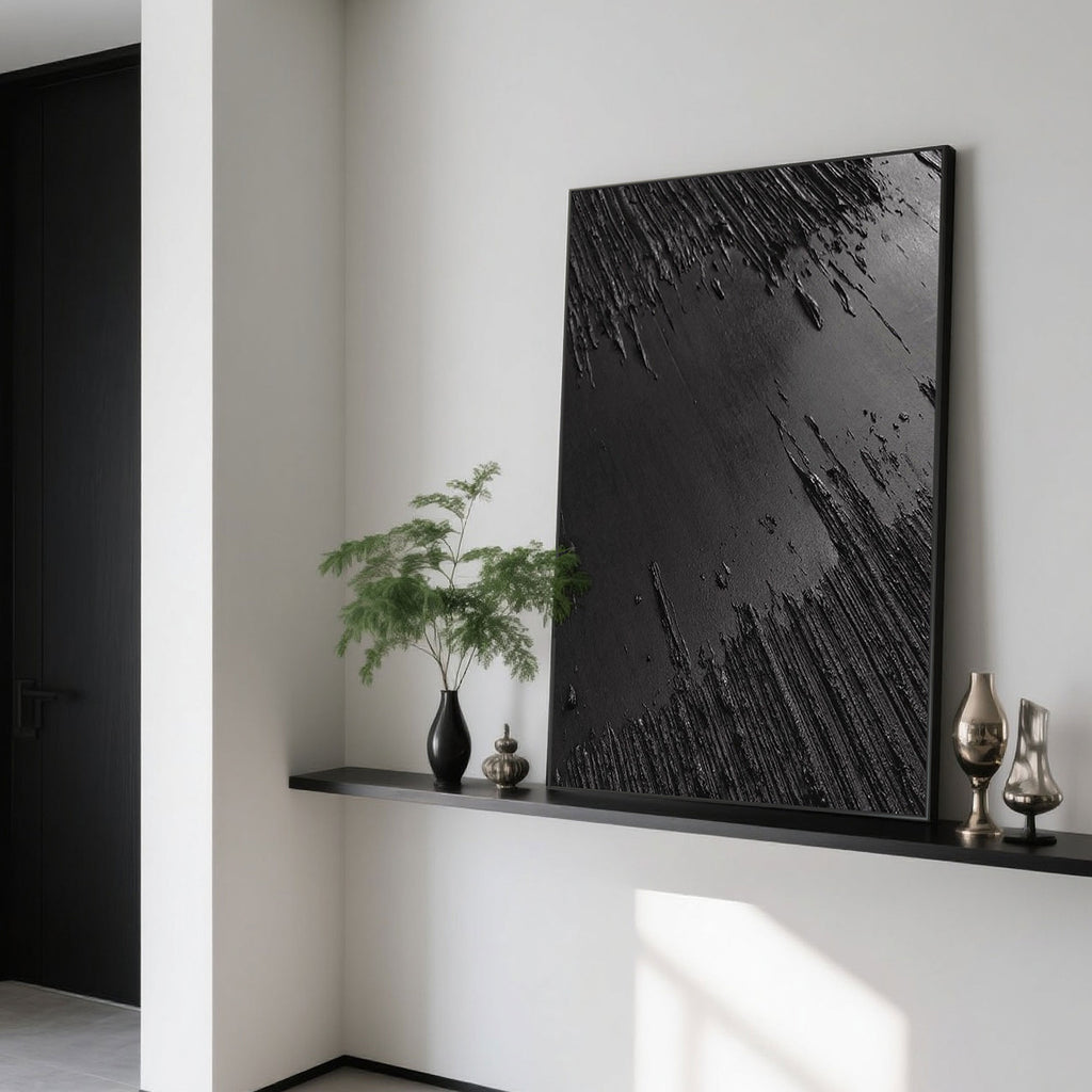 Black Wabi-Sabi canvas art on a shelf with decorative vases.