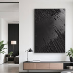 Wabi-Sabi black canvas art in a well-lit entryway.