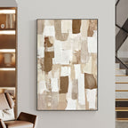 Beige and brown abstract art in a modern home with stairs.