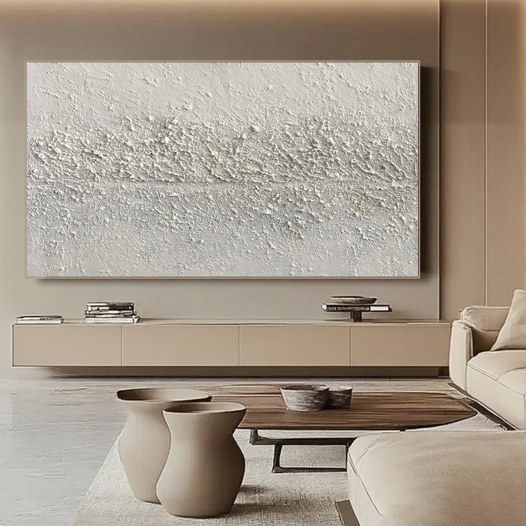 Neutral wabi-sabi art displayed above a console table, enhancing a serene living space.