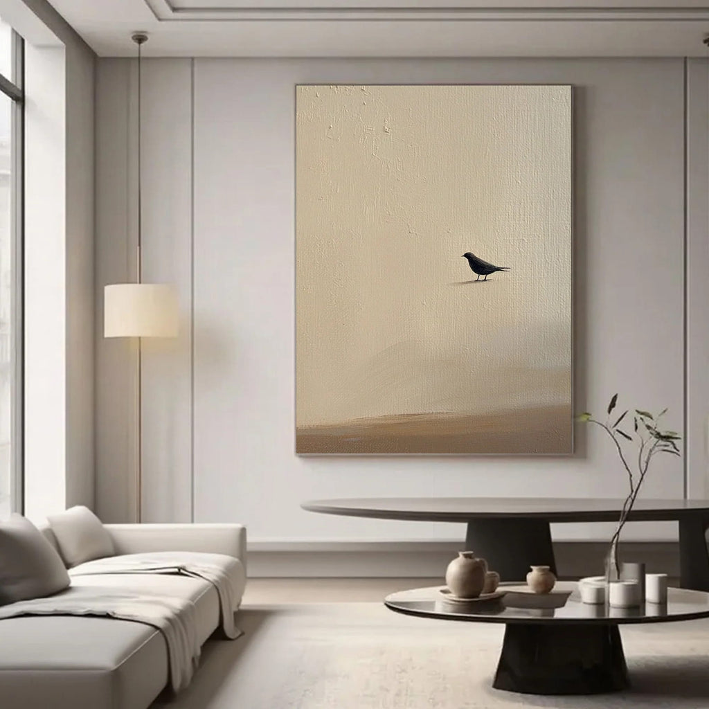 Zen minimalist bird wall art with black bird on textured beige canvas in modern living room