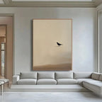 Zen minimalist bird wall art featuring black bird on textured beige canvas in modern living room