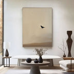 Zen minimalist bird wall art - black bird silhouette on beige textured canvas in modern living room