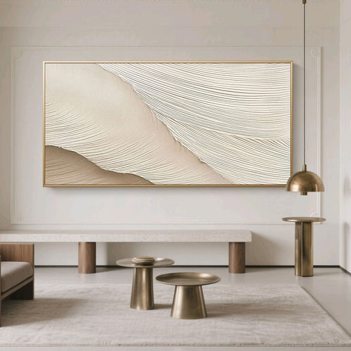 Minimalist Abstract Wave Wall Art – Soft Crest: soft beige and cream textured waves, gold frame, displayed in modern living room with neutral tones and brass accents.