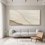 Hand-painted minimalist abstract wave wall art with textured lines, beige/cream tones, framed, above modern living room sofa