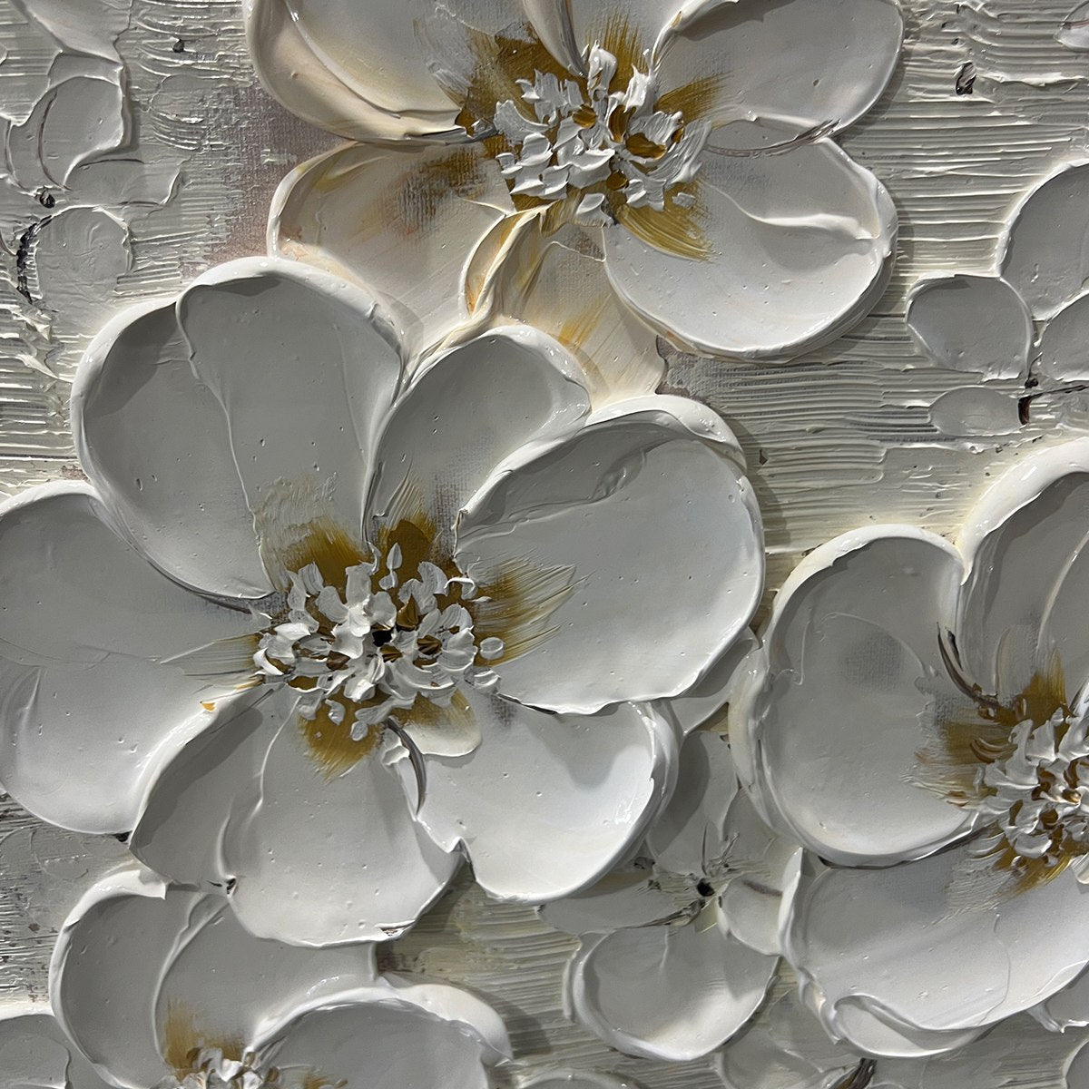 Close-up of hand-painted white flower petals with raised detailing.