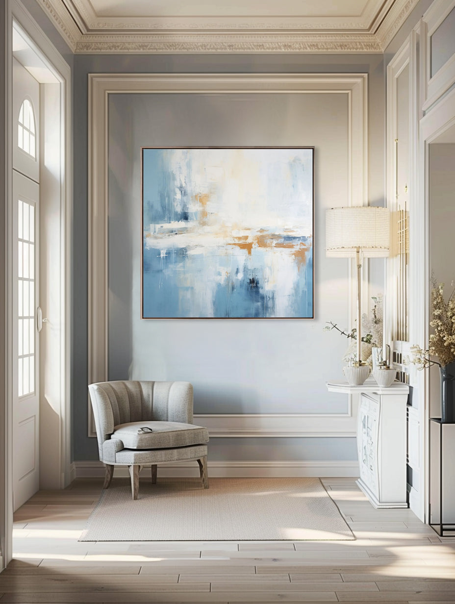 Abstract blue and white canvas art in a blue and white living room setting.
