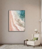 Abstract beach scene with pink and blue tones, featuring textured ocean waves and sandy shore