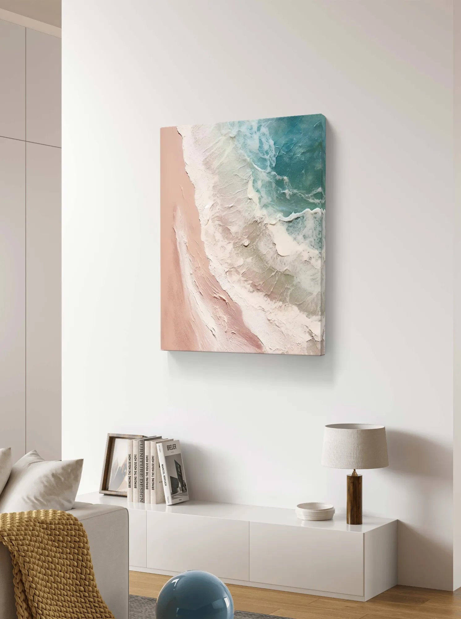 Abstract beach scene with pink and blue tones, featuring textured ocean waves and sandy shore