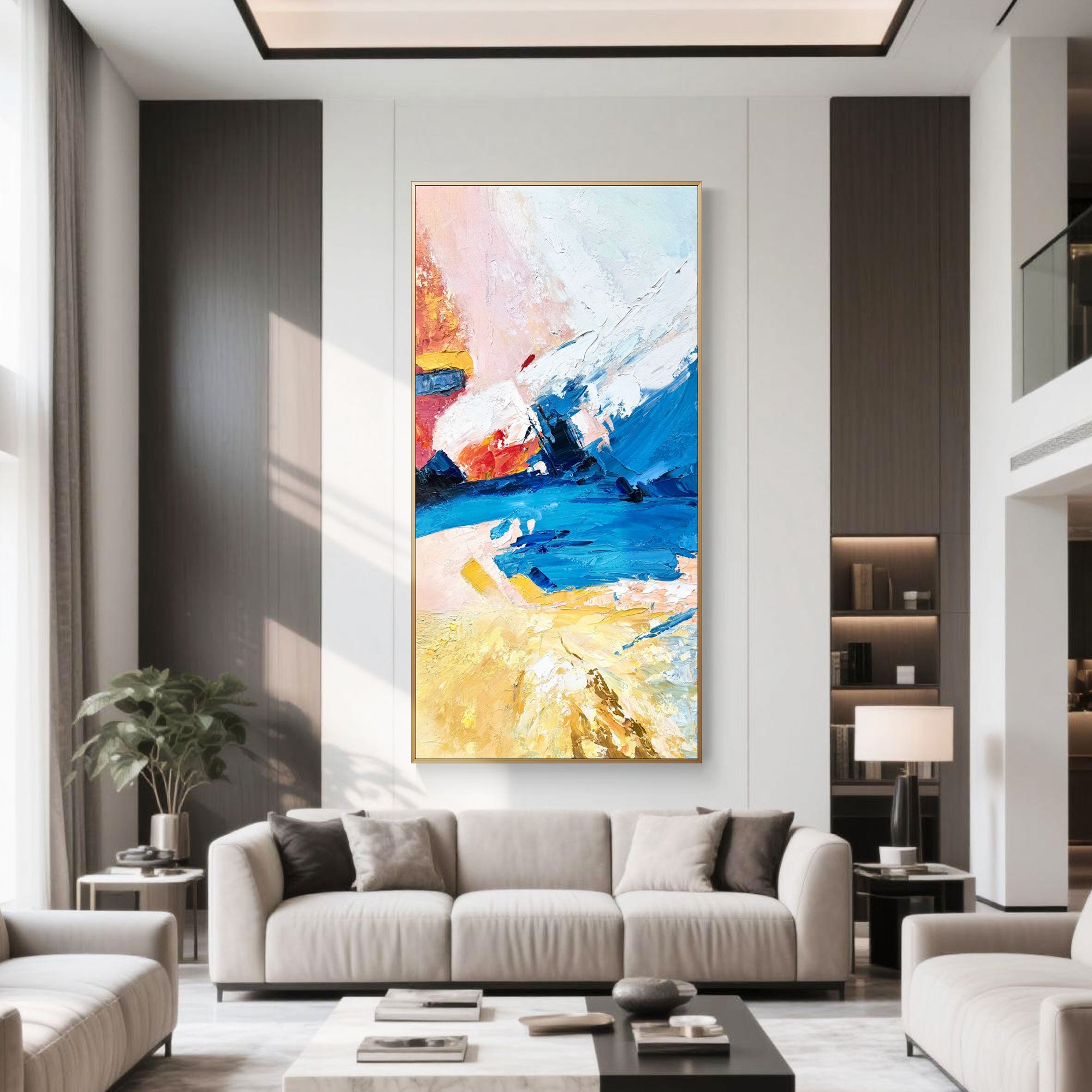 Modern living room with vertical abstract painting above a beige sofa.