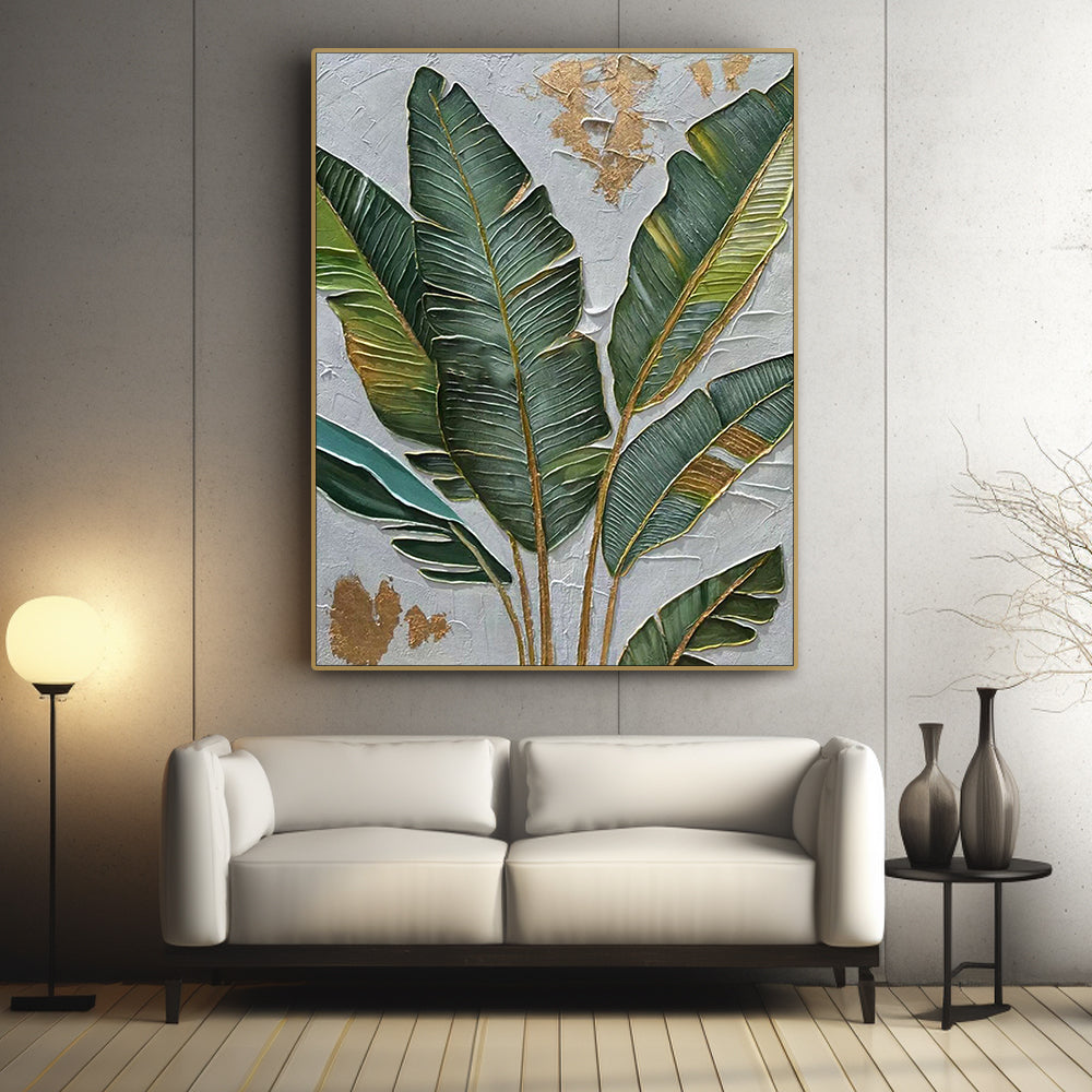 Banana leaf art above a white sofa in a modern living room.