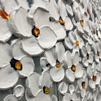 Close-up of textured impasto flowers in white with silver accents on the floral painting.
