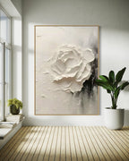 A bright room with a window, the black - and - white textured rose artwork on the wall complementing the natural light, creating a serene modern atmosphere.