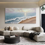 Modern seascape textured art above a gray modular sofa.
