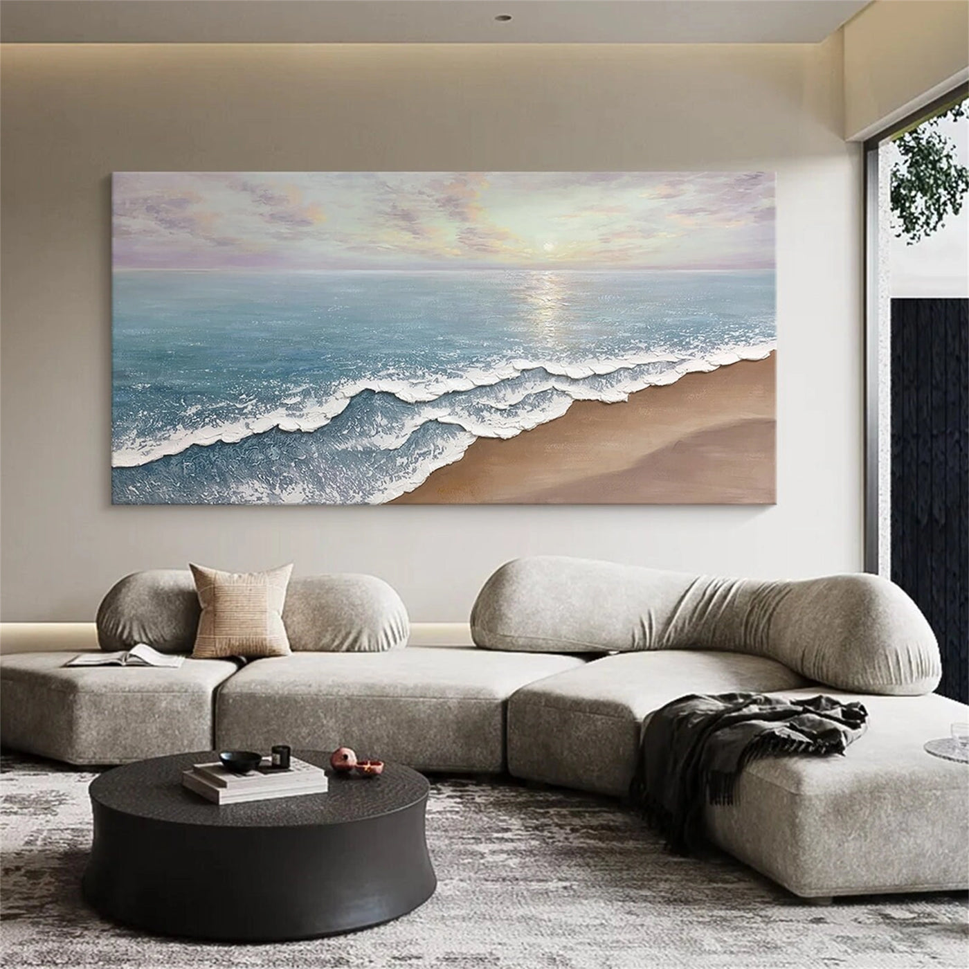 Modern seascape textured art above a gray modular sofa.