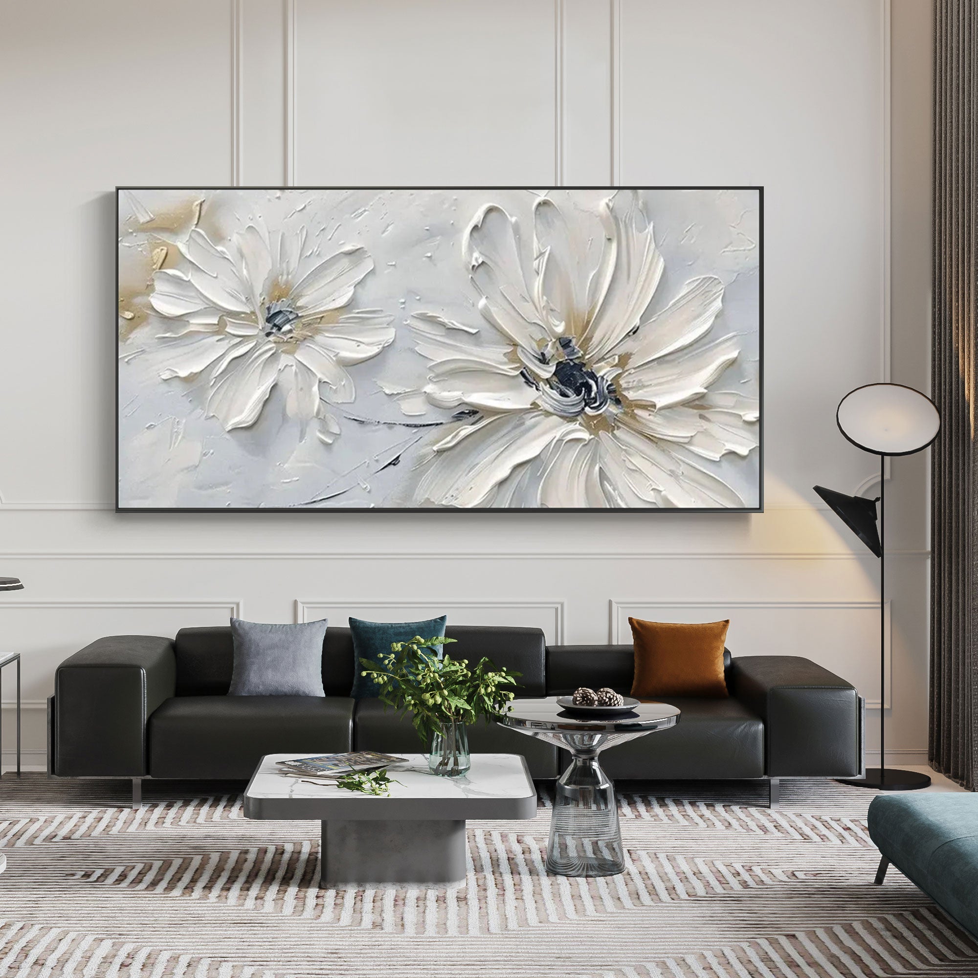 Modern living room with 'Petal Whisper' floral art above a black leather sofa.