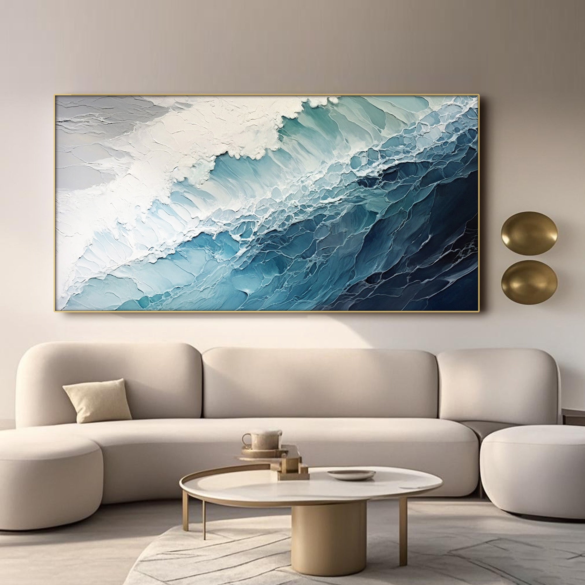 Hand-painted blue wave art in a gold frame above a modern living room.